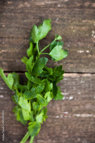 sprig of parsley on wood