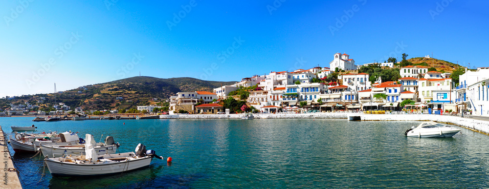 panoramic view of the fishing port of Batsi, on the island of Andros, famous Cyclades island in the heart of the Aegean Sea - obrazy, fototapety, plakaty 