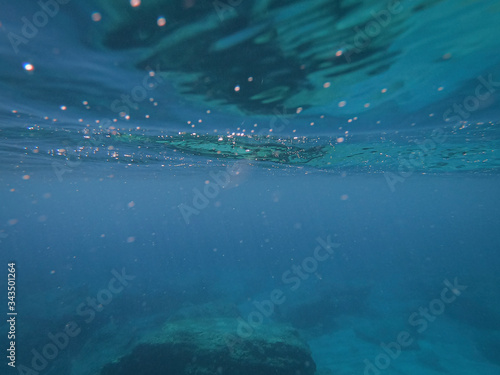 The surface of the water from under the water close-up.