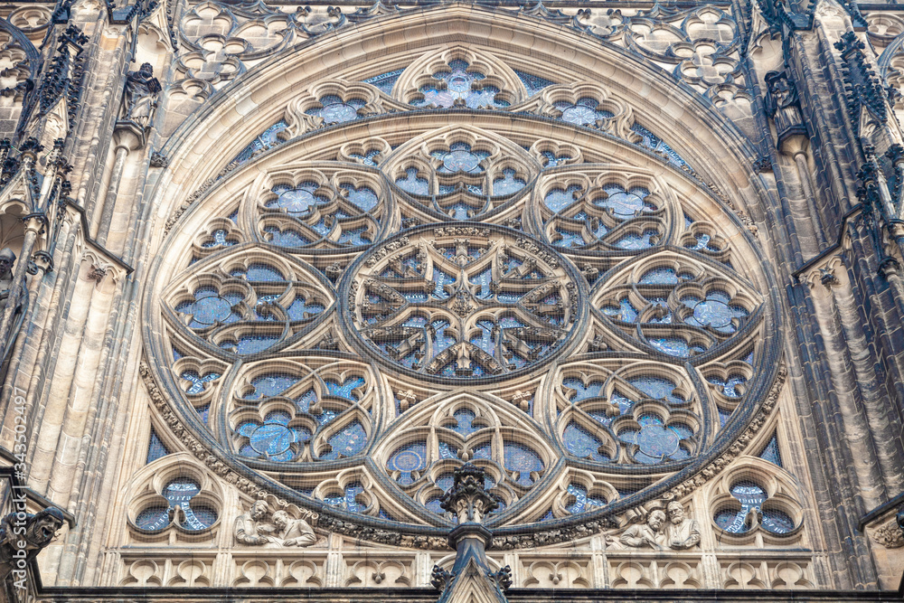 A round window with many decorations in a medieval gothic church
