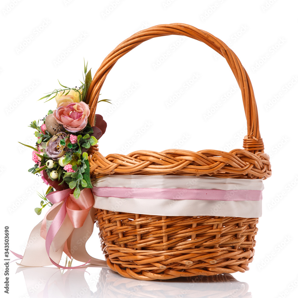 Provence Easter floral arrangement on a wicker basket with a vine. Isolated Provence Easter floral arrangement on a wicker basket with a vine. Isolated