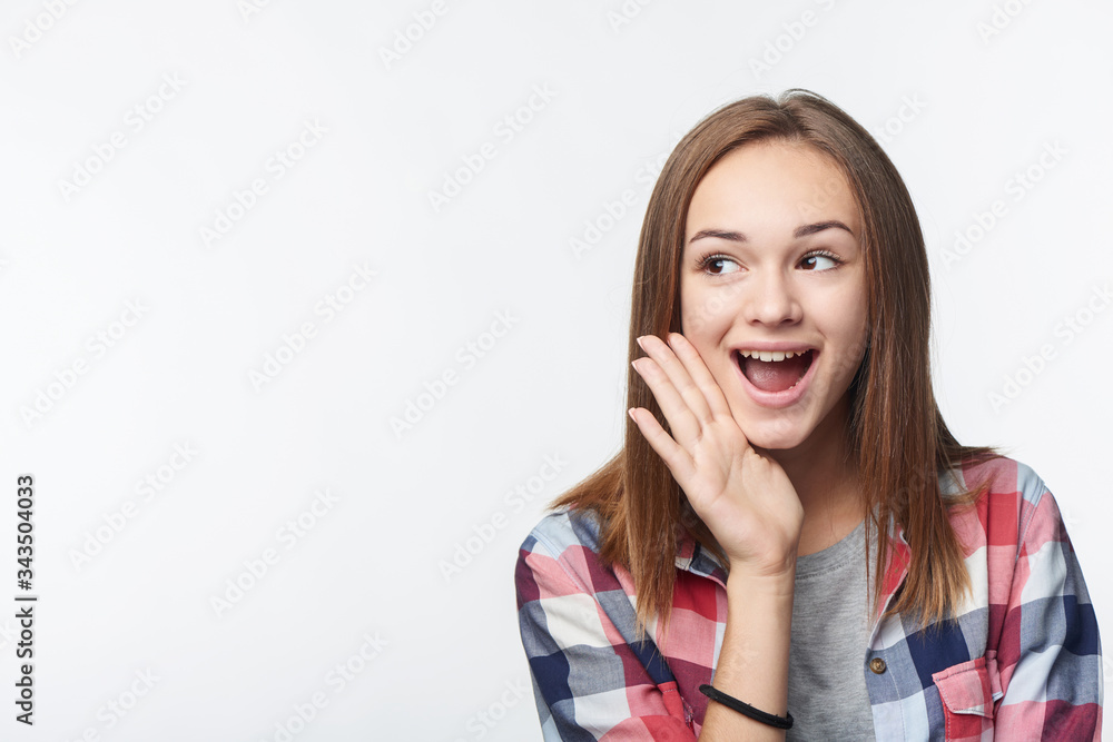 Surprised teen girl looking to the side Surprised teen girl looking to the side