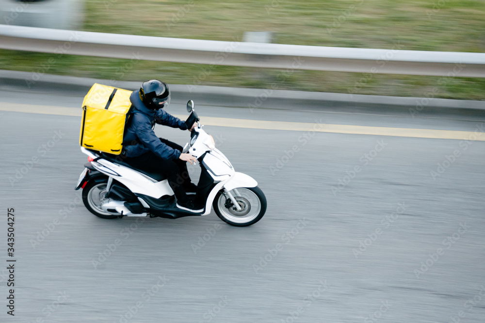 Delivery man riding scooter motorcycle with location mobile application