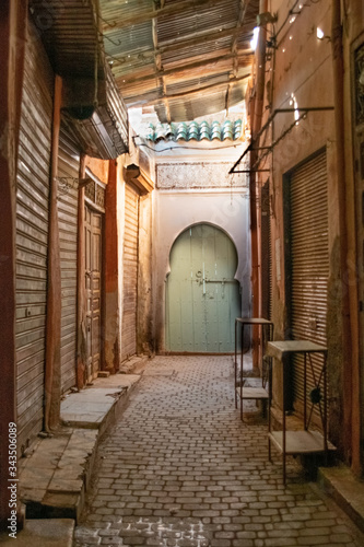 Marrakech, Morocco - 12.27.2019: Beautiful edges of the narrow Marrakech Medina streets with orange and brown building al around