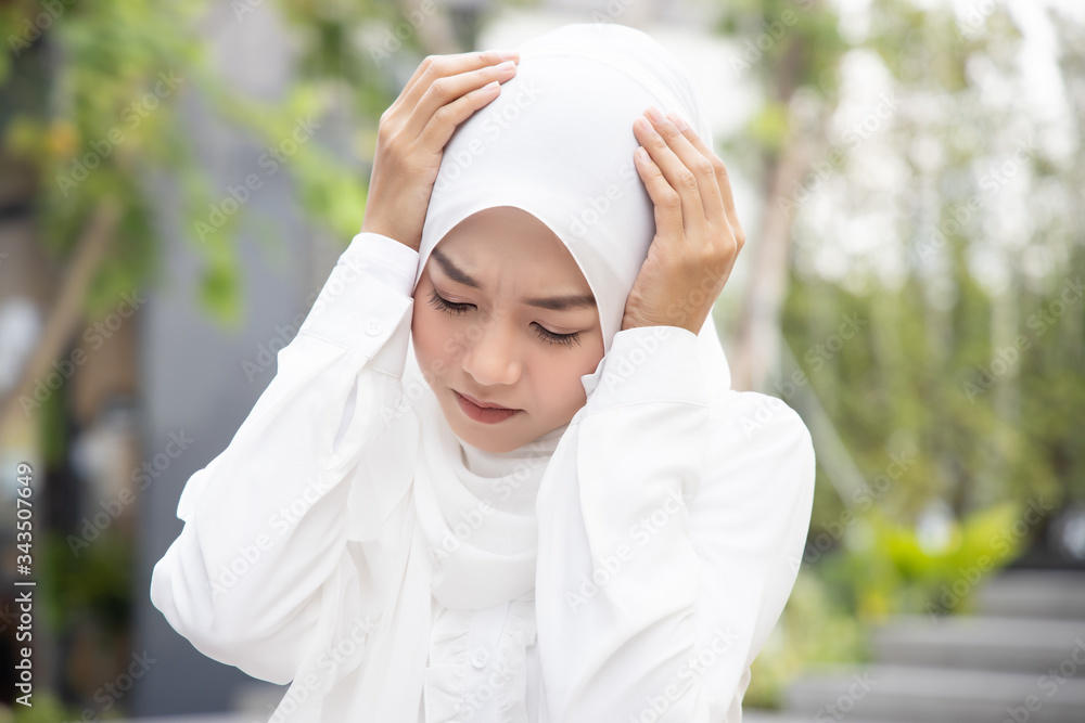 sick asian muslim woman having fever due to virus infection; concept of biohazard, biological hazard, health care, disease quarantine, coronavirus outbreak, sickness containment, COVID-19 coronavirus sick asian muslim woman having fever due to virus infection; concept of biohazard, biological hazard, health care, disease quarantine, coronavirus outbreak, sickness containment, COVID-19 coronavirus