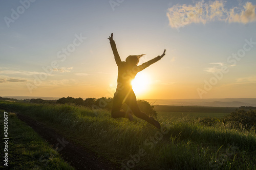 silhouette of a woman jumping
