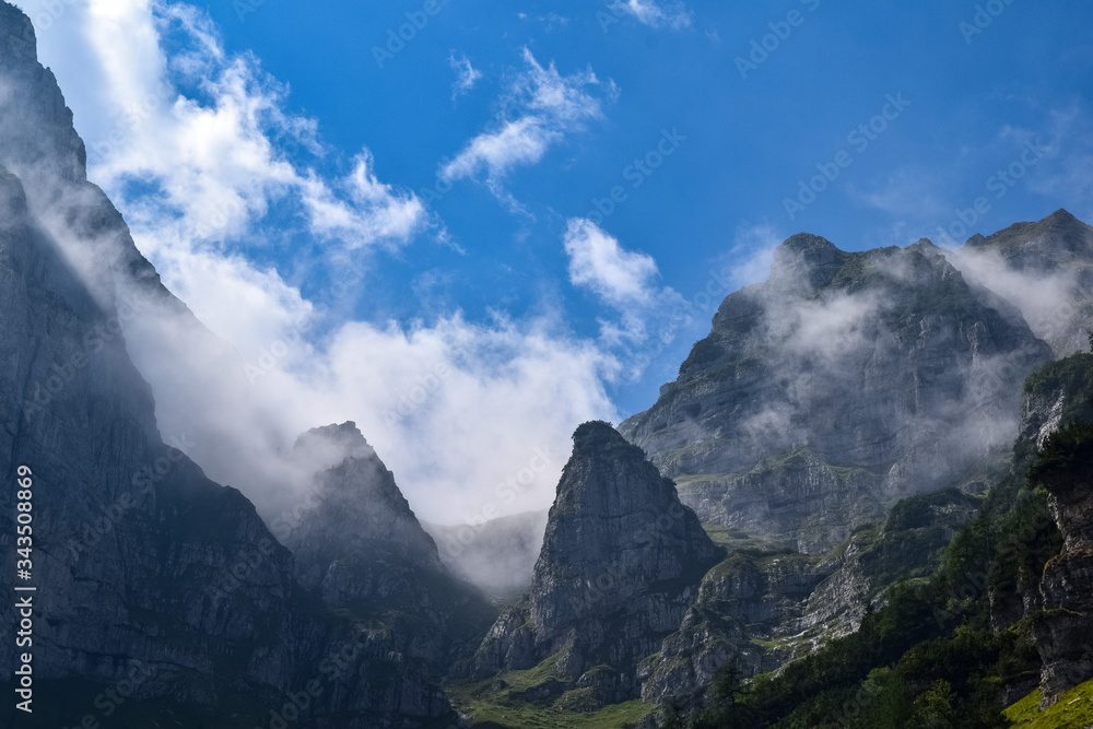 Cloudy mountain peaks of The Dolomites at the Brenta Adamello Mountains, Trentino, Italy