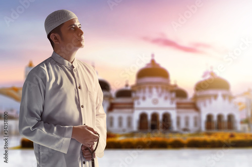 Portrait of young arab man at Baiturrahman Grand Mosque, Banda Aceh, Indonesia