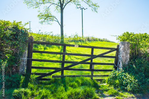 traditional wooden farm gate and stone posts in England