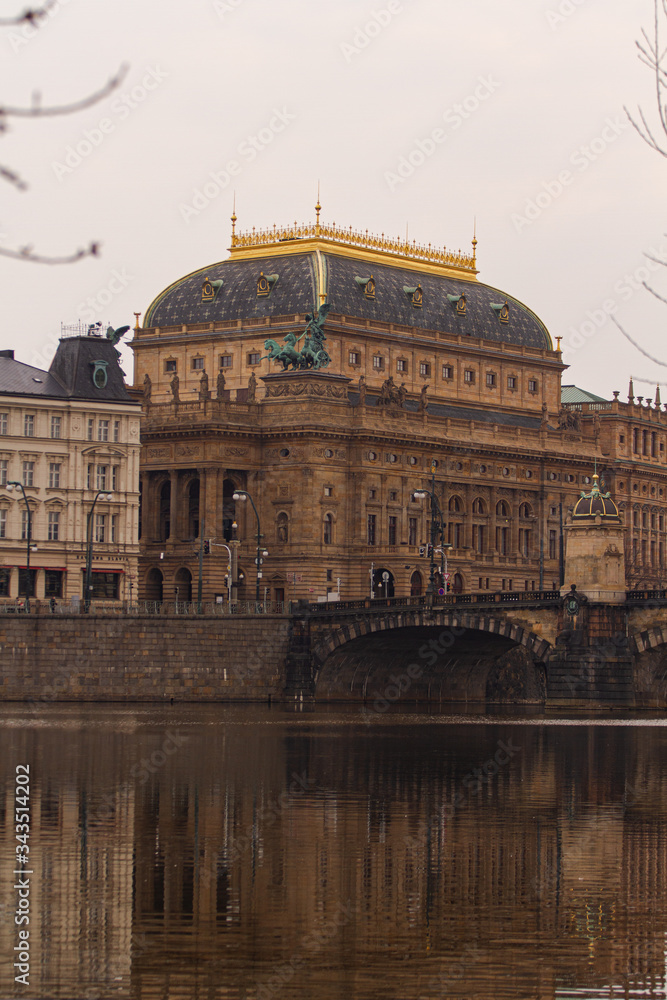 
view of the river and reflections in it. Old Prague architecture by the river Vltava. In the Czech Republic