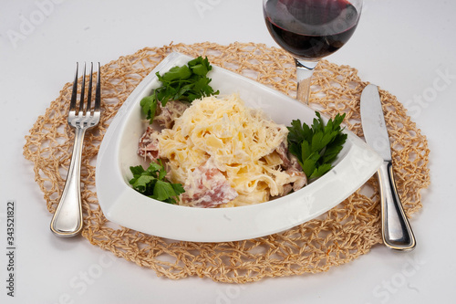 pasta with bacon and a glass of red wine photo