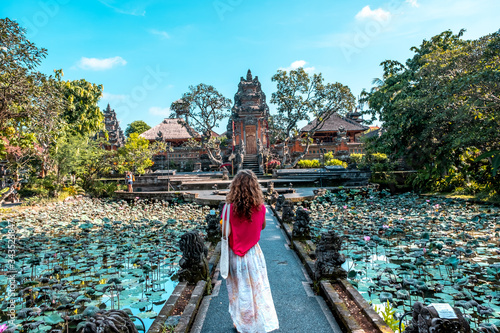 Ubud Palace, beauty woman on footpath in Ubud Province, Bali Island, Indonesia photo