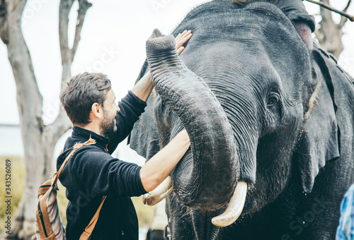 Canvas Print Man with elephant, tourist with elephant