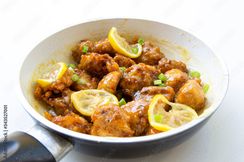 Sticky Chinese Lemon Chicken on the plate Sticky Chinese Lemon Chicken on the plate