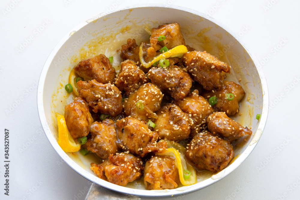 Sticky Chinese Lemon Chicken on the plate Sticky Chinese Lemon Chicken on the plate