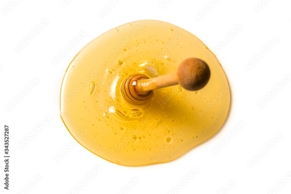 Dipper with honey on a white background. Dipper with honey on a white background.