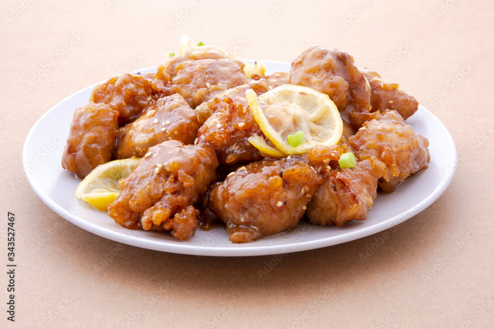 Sticky Chinese Lemon Chicken on the plate Sticky Chinese Lemon Chicken on the plate