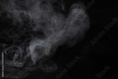 White steam on a black background.