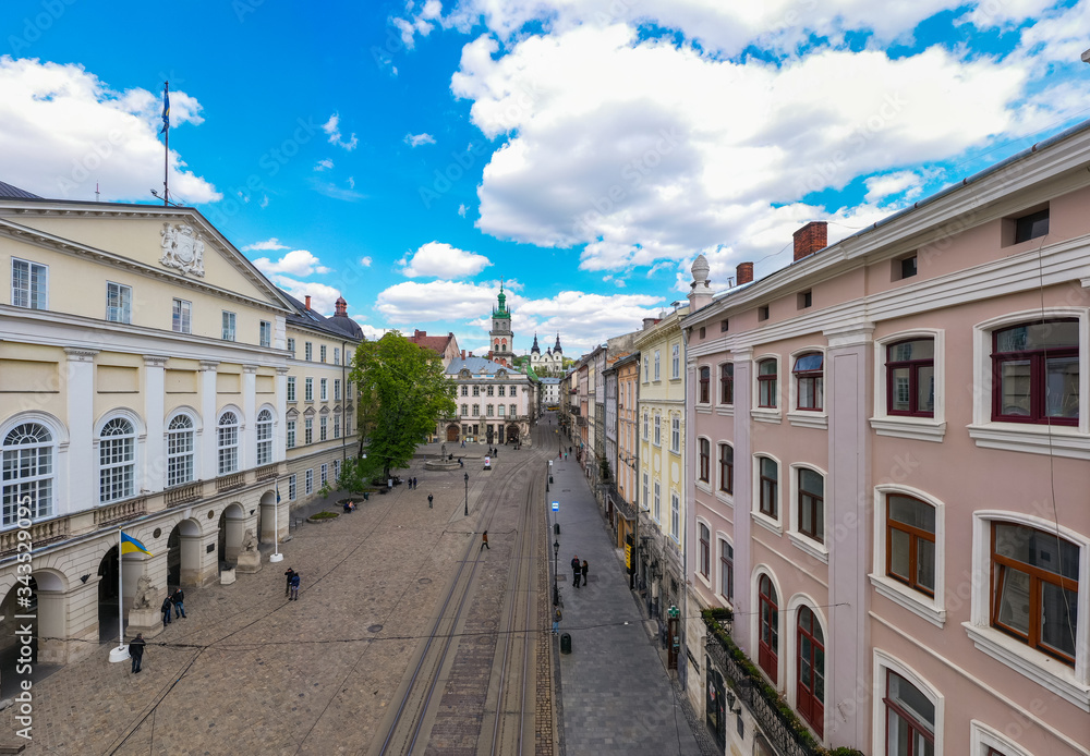 Aerial view on Market square, Dormition and Carmelite Church in Lviv, Ukraine from drone