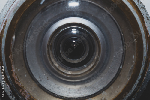 Old peephole macro. glass lens close up. abstract background
