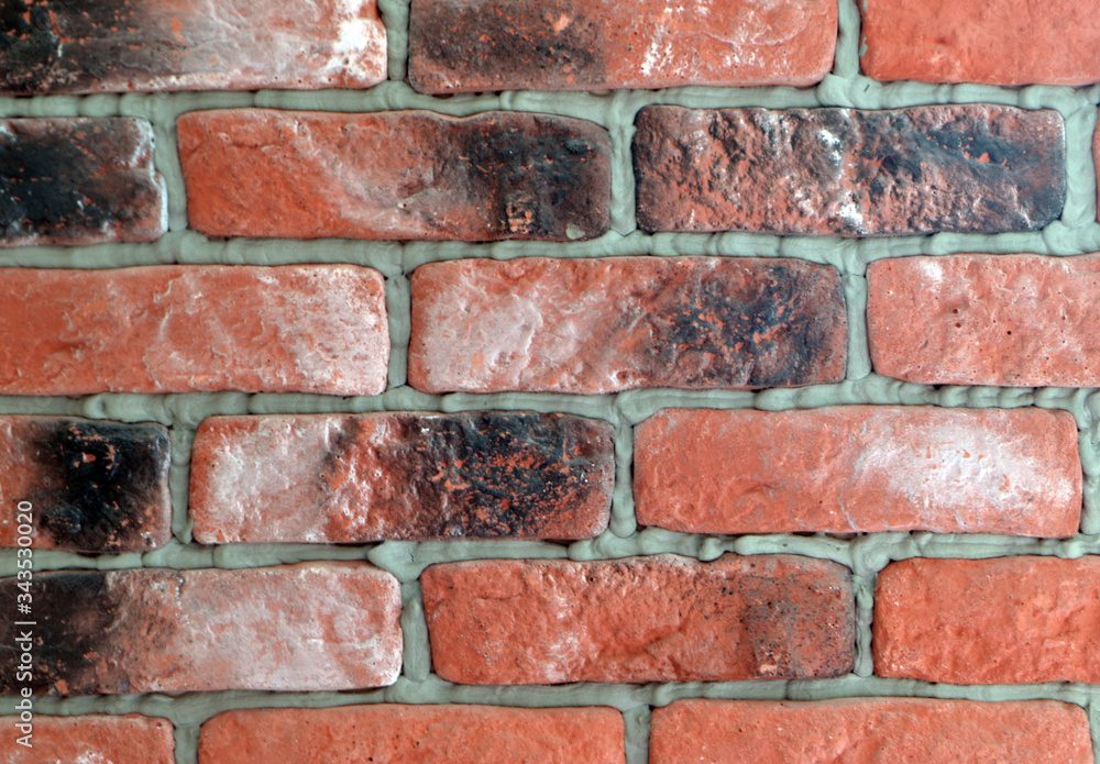beautiful red background made of decorative brickwork on the wall
beautiful red background made of decorative brickwork on the wall