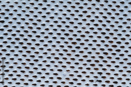Rubber surface with uneven holes. white plastic texture with dots