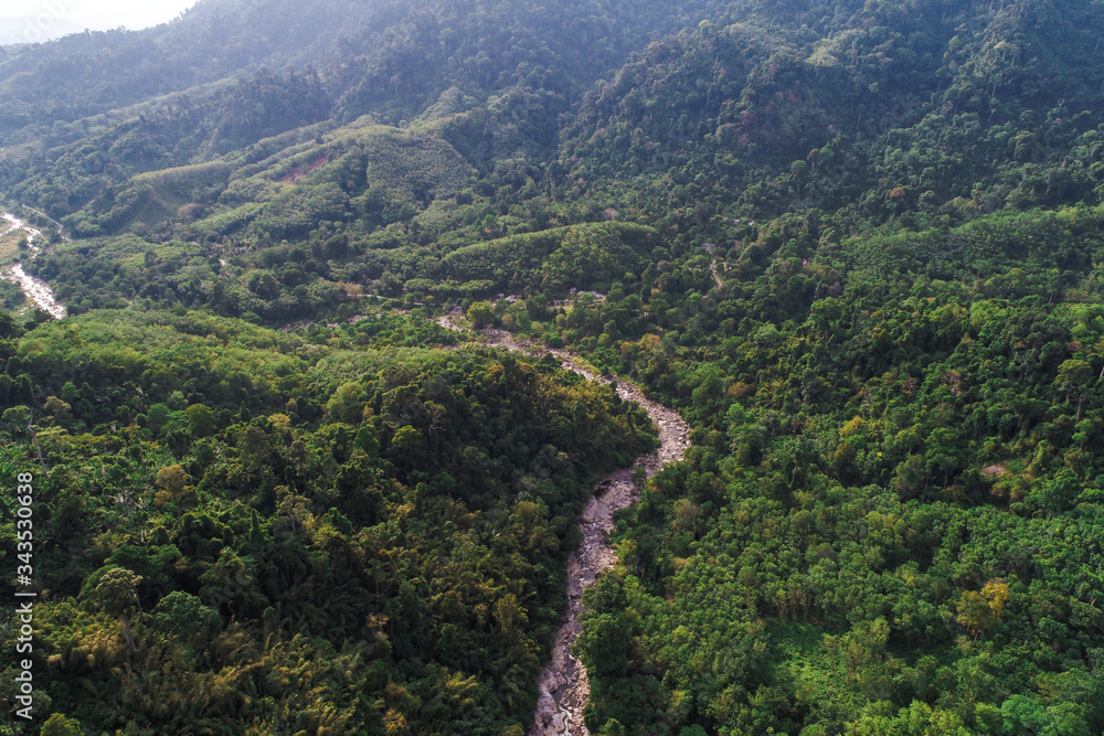 Deep waterfall river mountain green forest aerial view