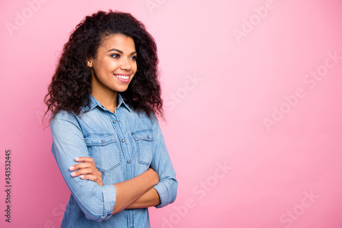 Turned photo of positive content afro american girl cross hands look copyspace wear stylish trendy youth clothing isolated over pastel color background