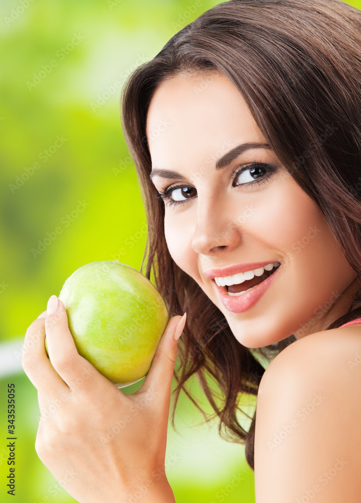 Portrait picture of happy smiling woman with green apple Portrait picture of happy smiling woman with green apple