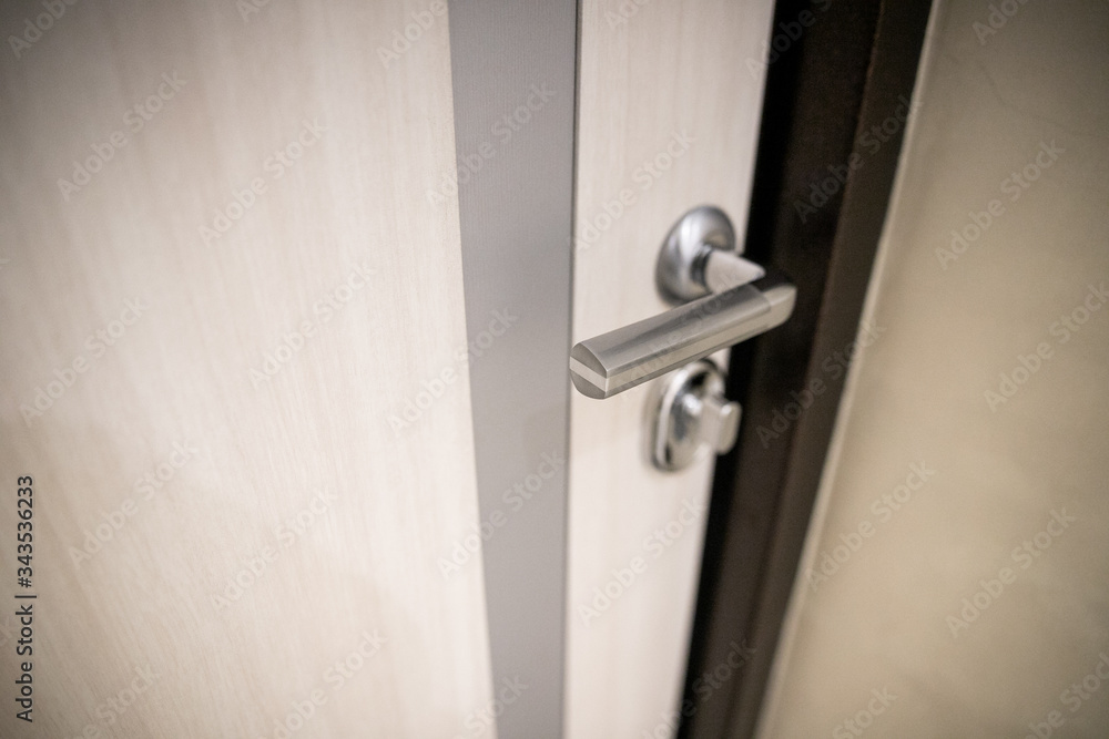 Modern, contemporary satin handle and keyhole detail Modern, contemporary satin handle and keyhole detail