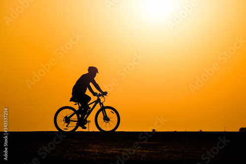 Wallpaper Mural Silhouette man cycling on sunset background Torontodigital.ca