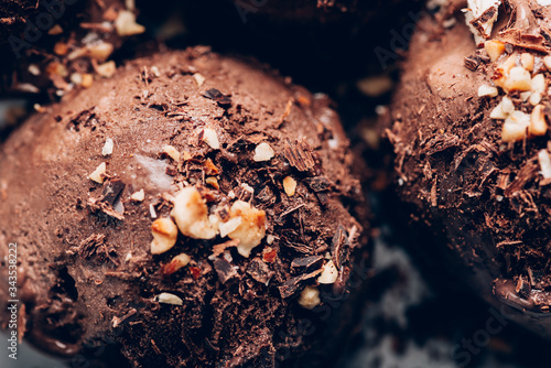 Rich and Indulgent Chocolate Ice Cream Scoops with dark chocolate pieces on a plate