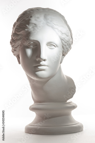 Gypsum copy of ancient statue Venus head isolated on white background. Plaster sculpture woman face.
