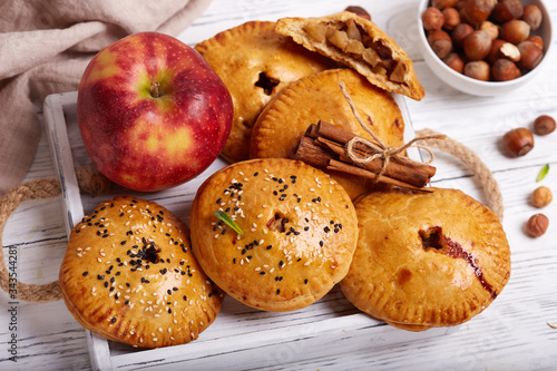 Delicious small sweet pies filled with apples, cinnamon and hazelnuts