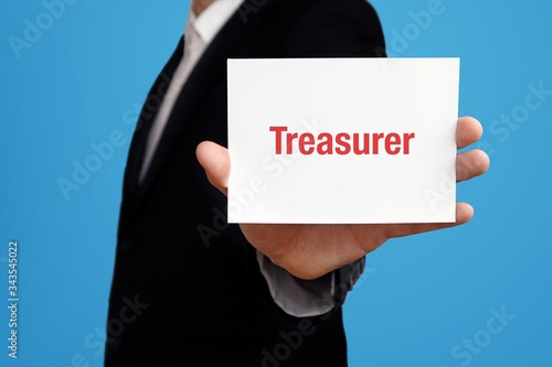 Treasurer. Business man in a suit holds card at camera. The term Treasurer is in the sign. Symbol for business, finance, statistics, analysis, economy