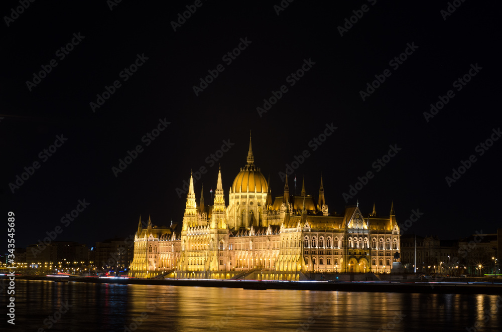 Night view of the illuminated building of the hungarian parliament in Budapest, Hungary.