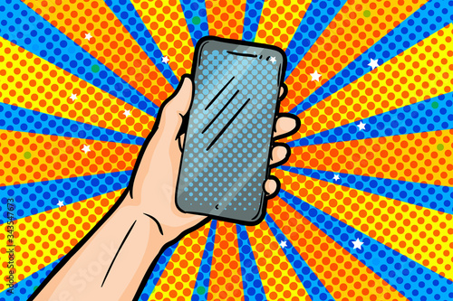 Hand holding smartphone in pop art style on yellow blue background.