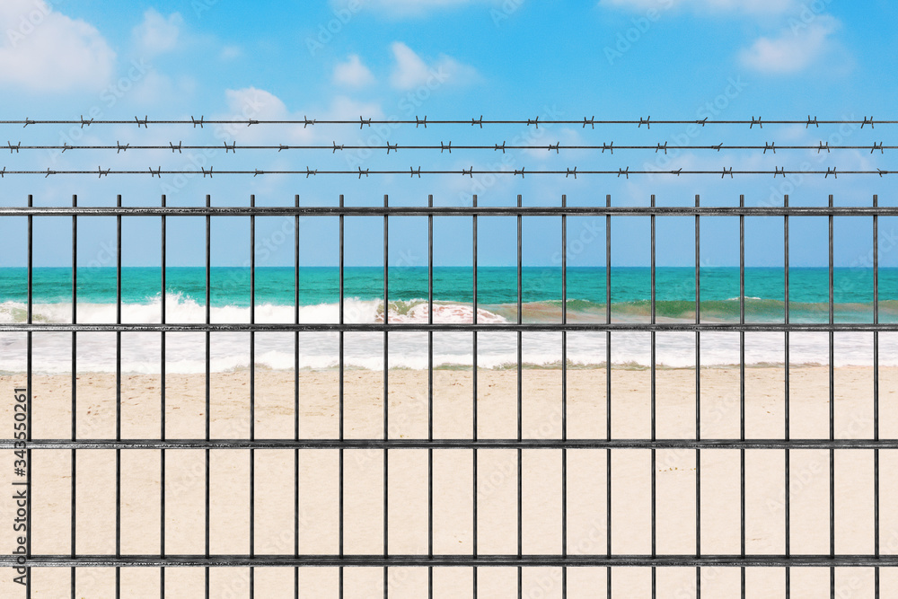 Quarantine due to Novel Coronavirus COVID-19 2019 n-CoV Concept. Metal Fence with Barbed Wire in front of Sand Ocean Beach. 3d Rendering Quarantine due to Novel Coronavirus COVID-19 2019 n-CoV Concept. Metal Fence with Barbed Wire in front of Sand Ocean Beach. 3d Rendering