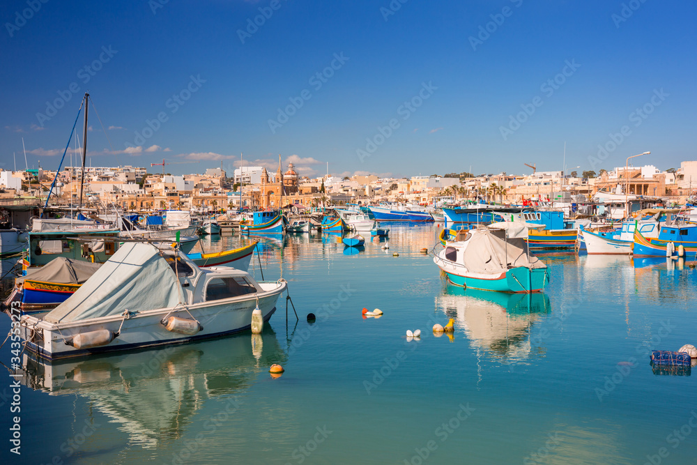 Fishing boats in the Mediterranean Village of Marsaxlokk, Malta Fishing boats in the Mediterranean Village of Marsaxlokk, Malta