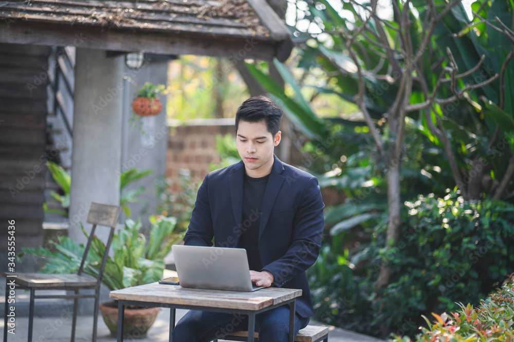 Business man working on laptop computer at home during quarantine for coronavirus. Work from home and social distancing concept. Business man working on laptop computer at home during quarantine for coronavirus. Work from home and social distancing concept.