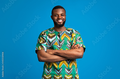 African man with traditional clothes and crossed arms photo
