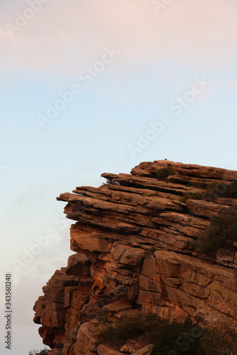 Cliff mountainous profile with clear sky in the background