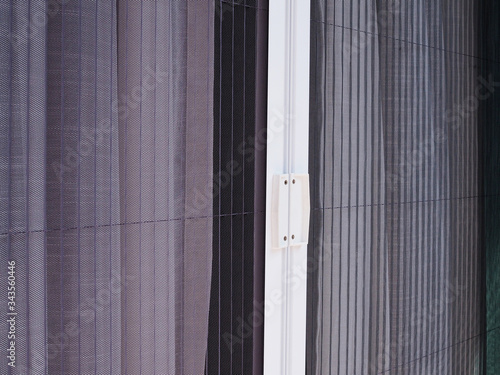 white frame door with mosquito net wire screen
