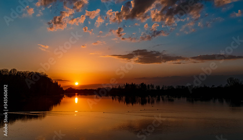 Beautiful sunset with reflections near Ettling, Isar, Bavaria, Germany