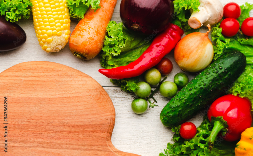 Vegetarian food.Cutting board, vegetables for cooking.Top view. Vegetarian food.Cutting board, vegetables for cooking.Top view.