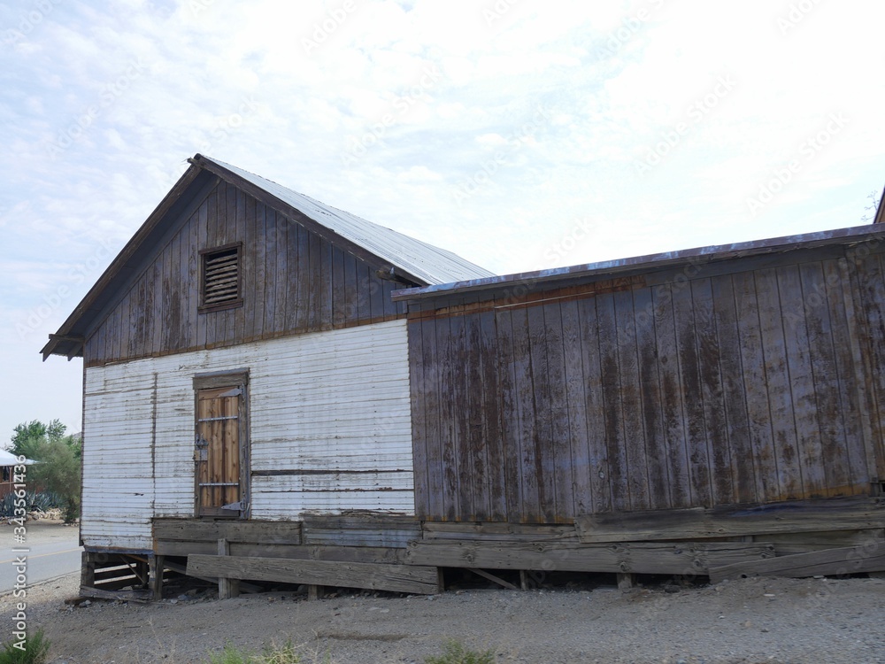 Old wooden structure with loose floors at Randsburg, one of the mining ghost towns in California. Old wooden structure with loose floors at Randsburg, one of the mining ghost towns in California.