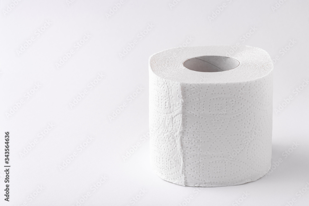 A roll of toilet paper on a white background. Copy space. Space for text. A roll of toilet paper on a white background. Copy space. Space for text.