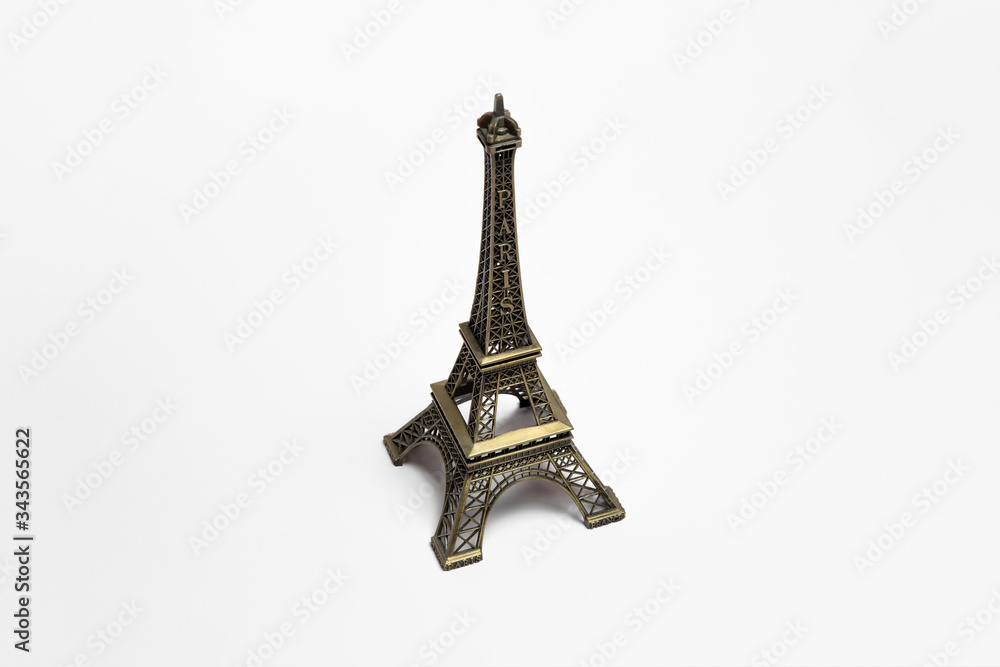 The small Eiffel tower as a souvenir from Paris. Isolated on a white background.High-resolution photo
