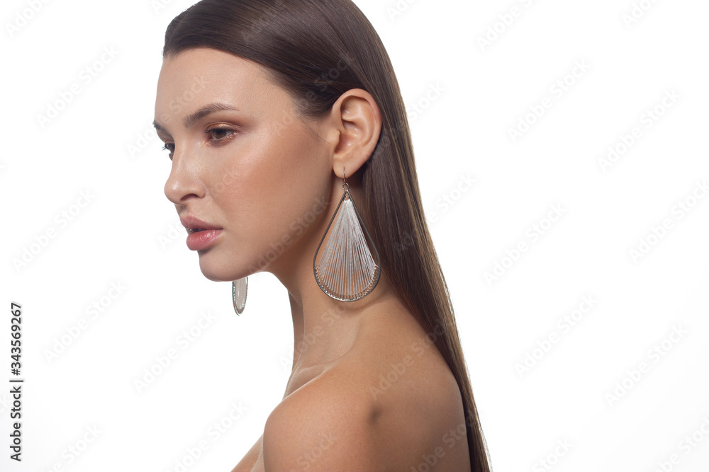 Fototapeta premium Close-up portrait of a beauty woman with full lips, straight hair and perfectly clean skin. Daytime makeup, styling and soft care. Skin care in the spa salon or cosmetology, smooth eyebrows