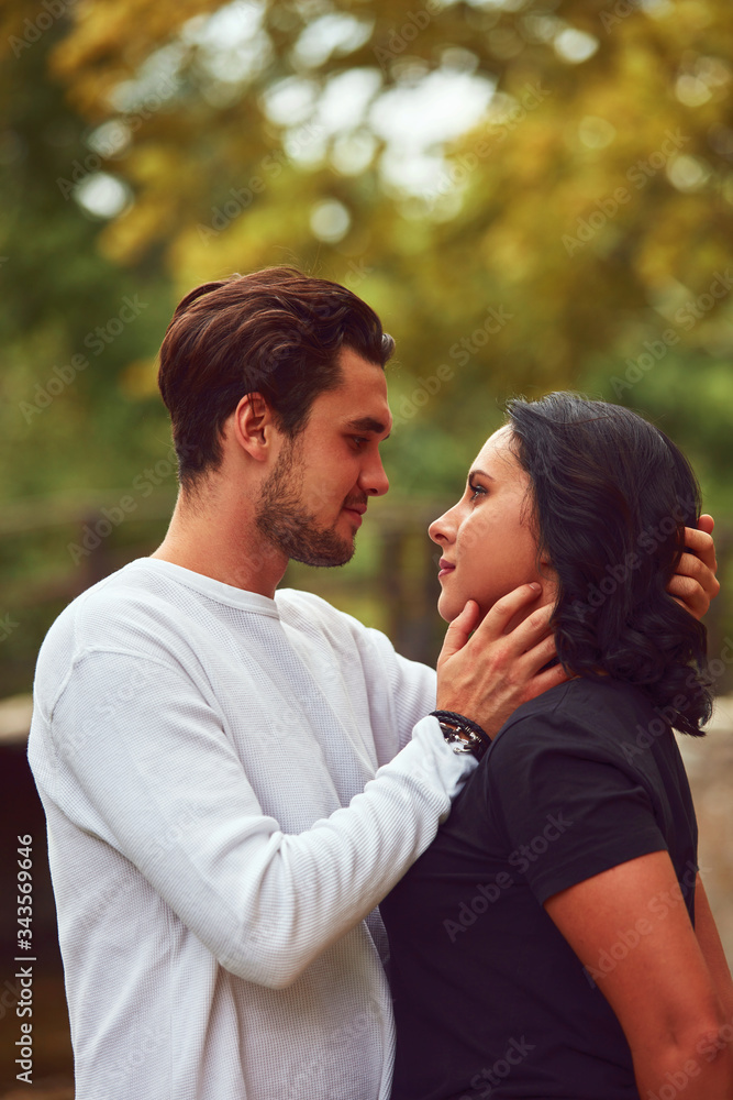 Couple in love hugging and kissing outdoors. Love concept. Couple in love hugging and kissing outdoors. Love concept.